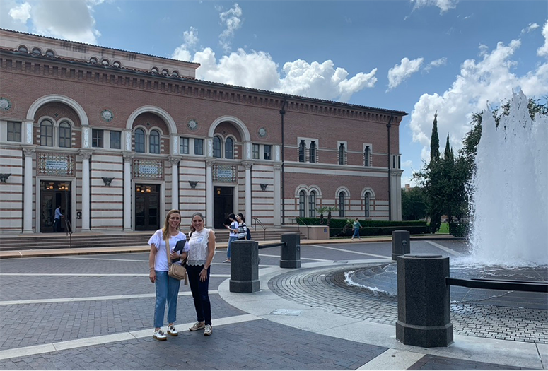 Ivonne (left) and Martha enjoyed exploring the Rice University campus. The Baker Institute for Public Policy is in the background.