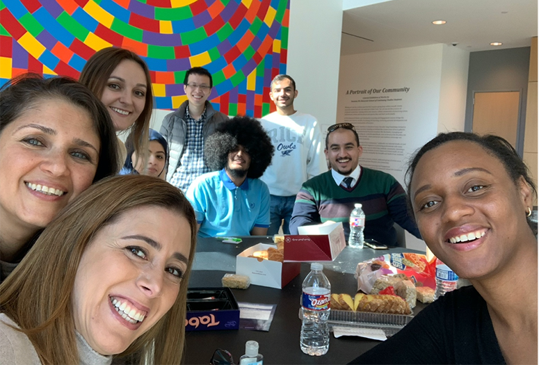 Ivonne (bottom left) takes a selfie with her teacher and classmates during an end-of-the-session celebration.
