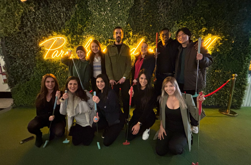 group of college students at mini golf
