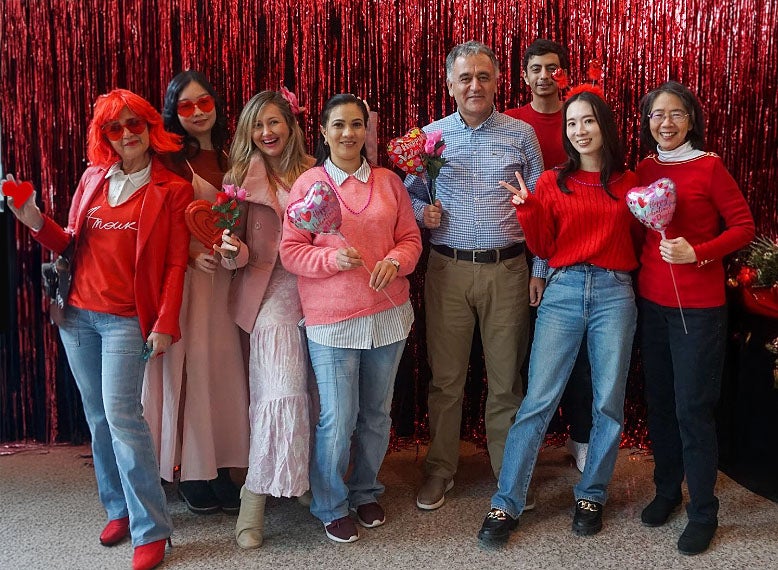 group of adult students gathered at a Valentine's Day party