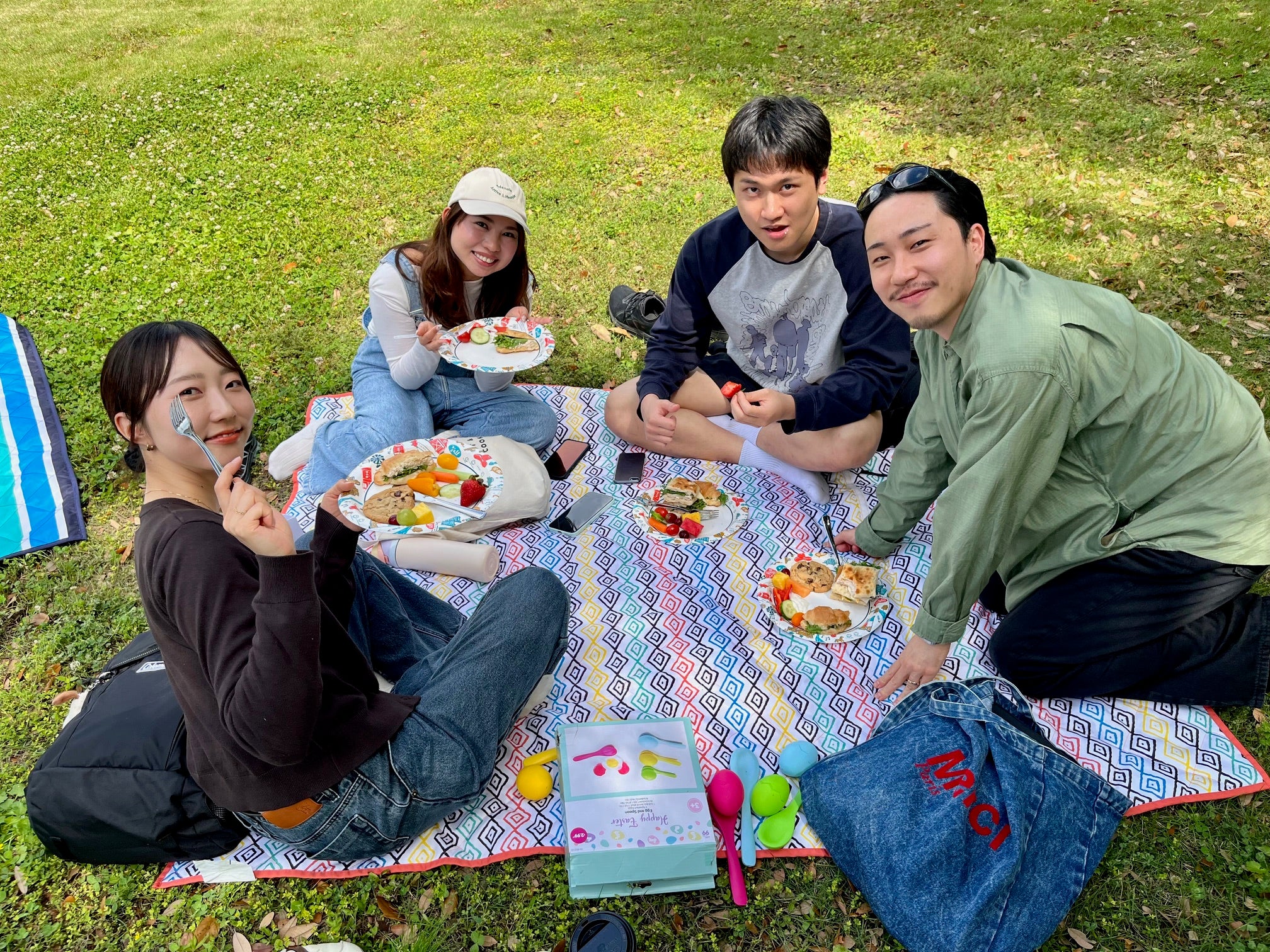 college students having a picnic outside