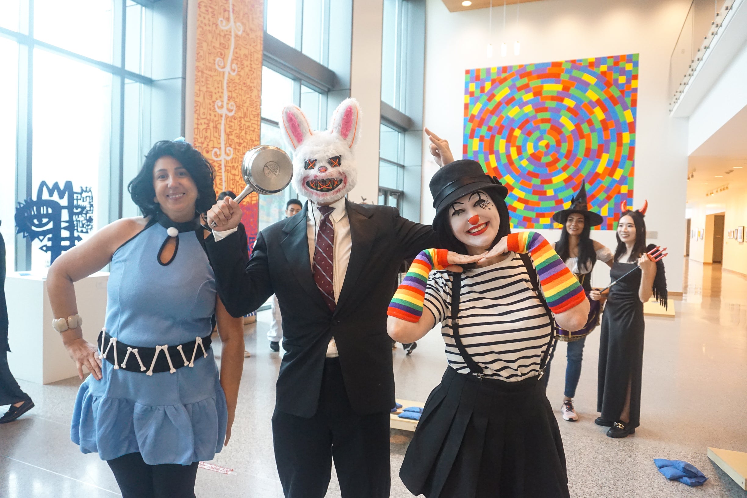 adult students wearing halloween costumes