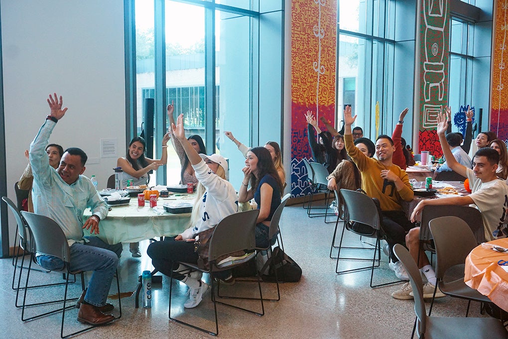 students eating around a Thanksgiving table