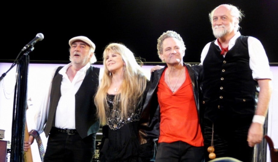 musicians standing together on stage