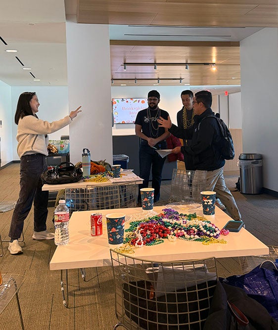 two adults playing rock paper scissors