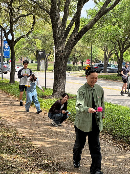 college students doing an egg race