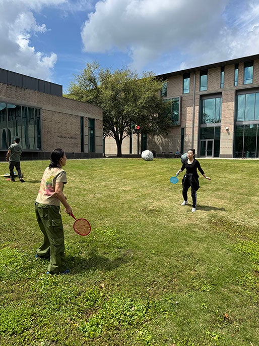college students playing raquetball