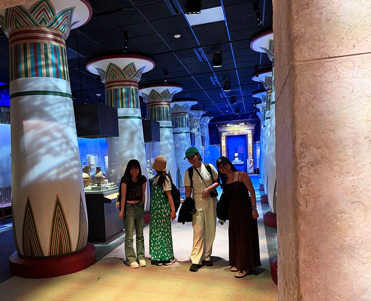 adult women inside an Egypt exhibit