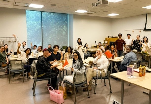group of adult international students at a party