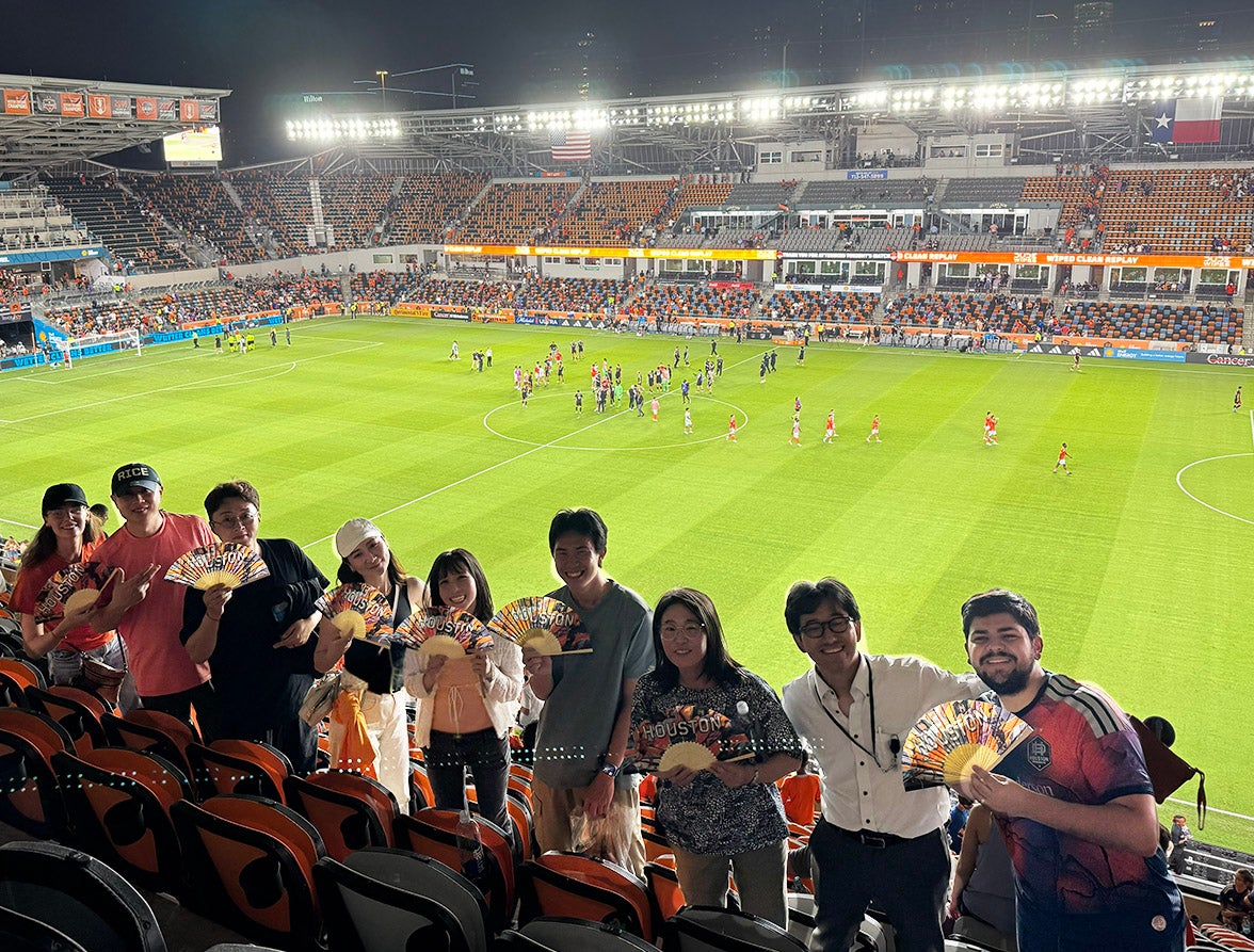 sts in soccer stadium with paper fans