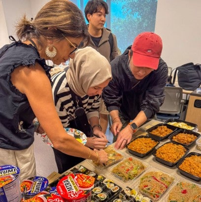 students from the Middle East and Korea eat together