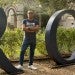 young hispanic man standing on Rice University campus