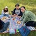 college students having a picnic outside