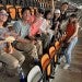 adult students watching soccer game in a stadium